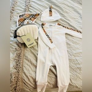 A three-piece baby gift set containing organic cotton woven